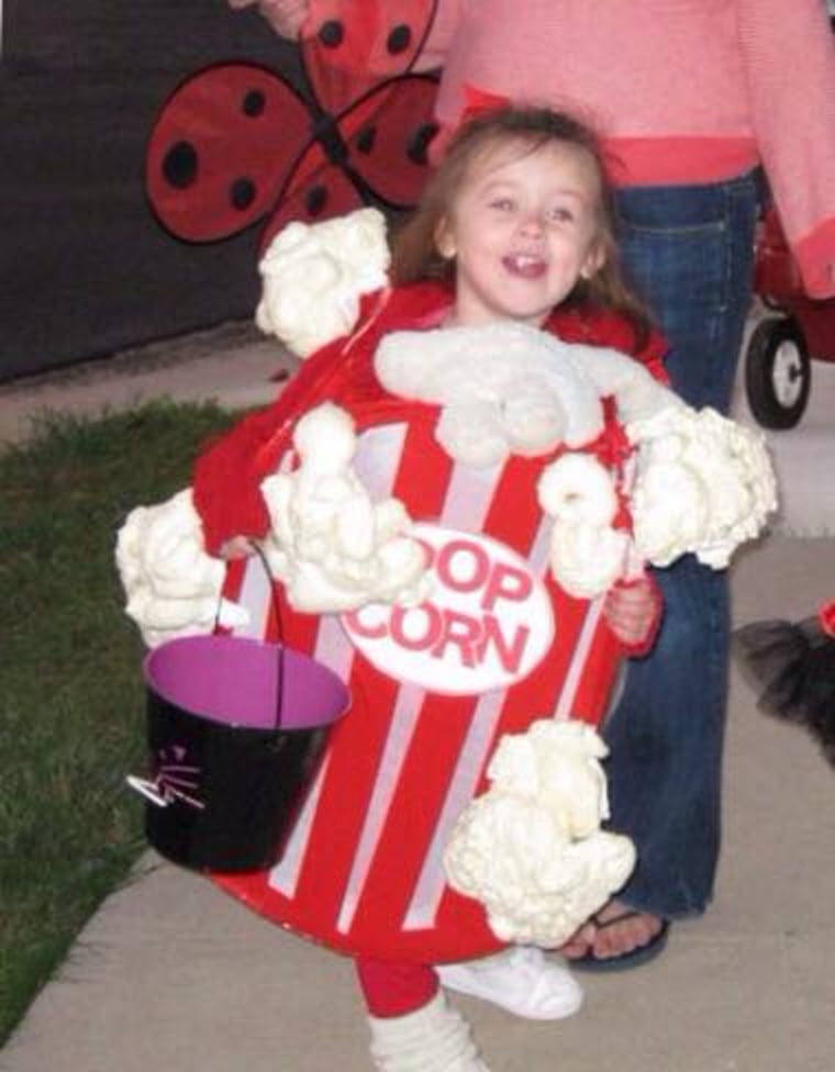 Pass the popcorn: Lisa Mendoza’s daughter wanted to be popcorn and got to go as a whole box: \"We used a popup hamper, red duct tape, and 'great stuff' foam insulation to make her costume.\"