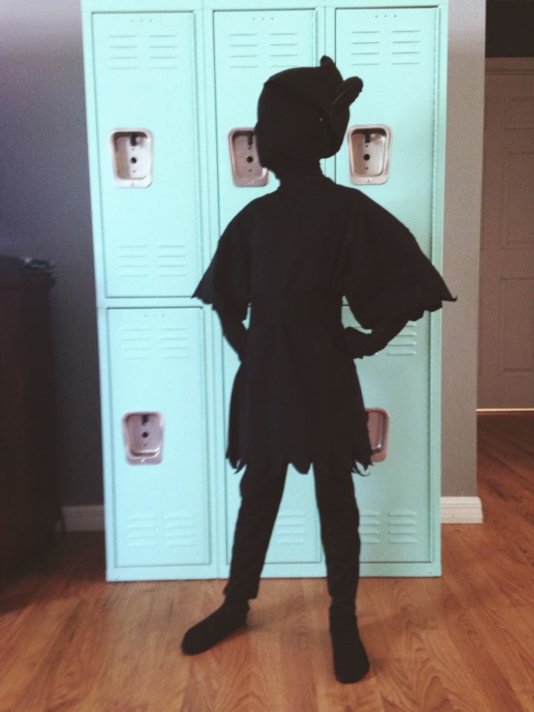Peter Pan's shadow! Jennifer Brown writes: \"Black morph suit with an adult black T-shirt on top. Cut shirt jagged to look like Peter. Cut a piece of black felt for hat. Sew or hot glue ends to form hat.\"