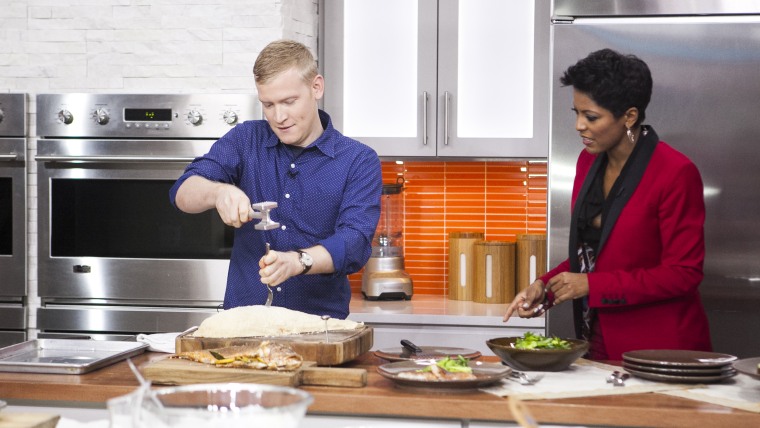 Justin Chapple and Tamron Hall prepare Pimenton-roasted red snapper on the TODAY show in New York, on Oct. 7, 2014.