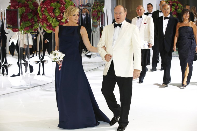 Prince Albert II of Monaco (R) and Princess Charlene arrive to attend the 66th annual Red Cross Gala, on August 1, 2014, in Monaco. Created in 1948, t...