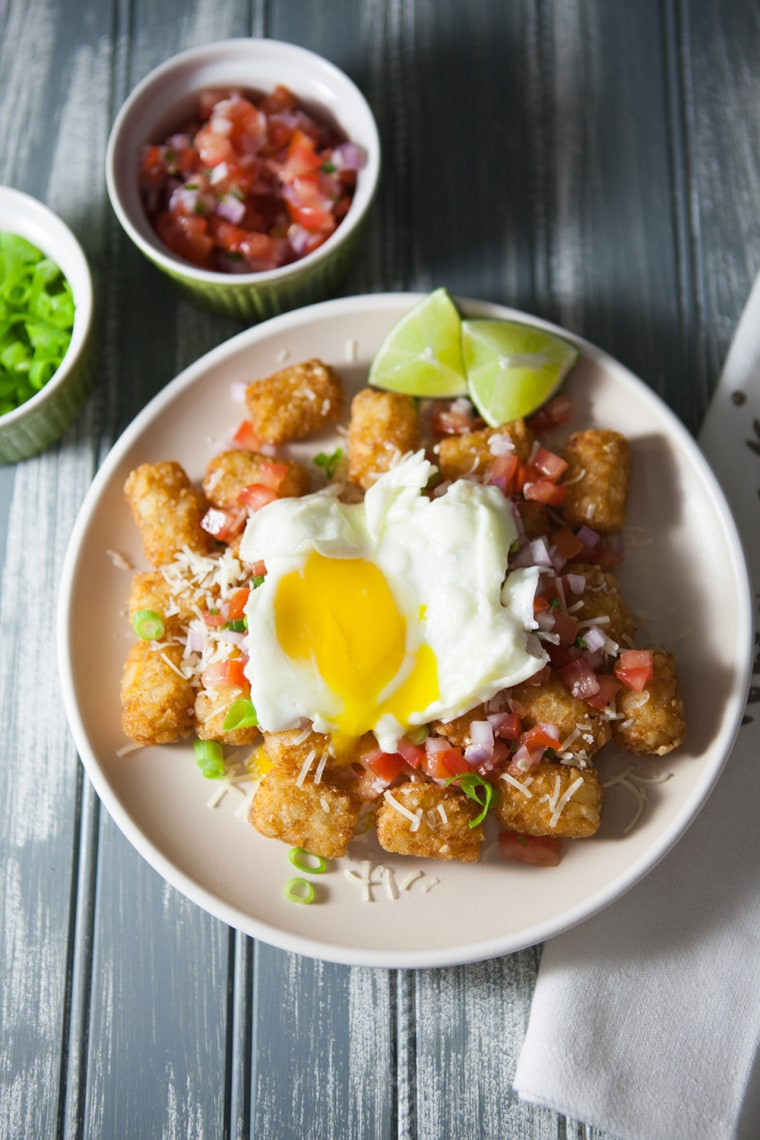 Tater tot nachos with an egg on top from The Little Kitchen
