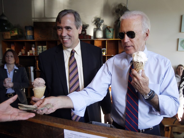 Vice President Joe Biden, right, pays for ice cream cones for himself and U.S. Sen. Jeff Merkley after a campaign rally in Portland, Ore., Wednesday, ...