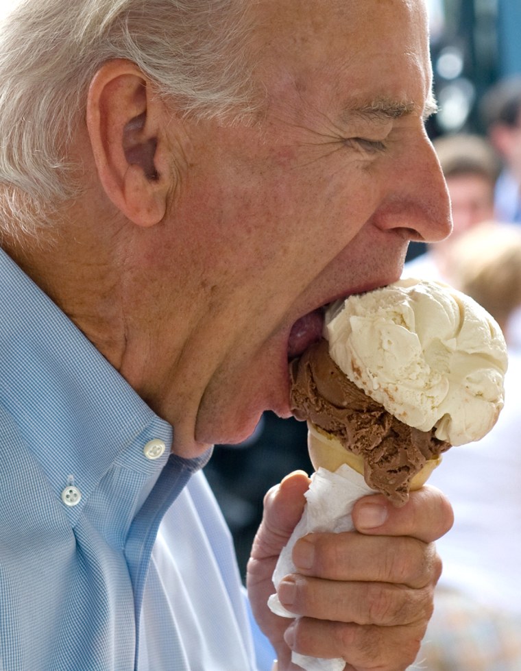 US Vice Presidential nominee Senator Joe Biden eats an ice cream cone at the Windmill Ice Cream Shop in Aliquippa, Pennsylvania, August 29, 2008, whil...