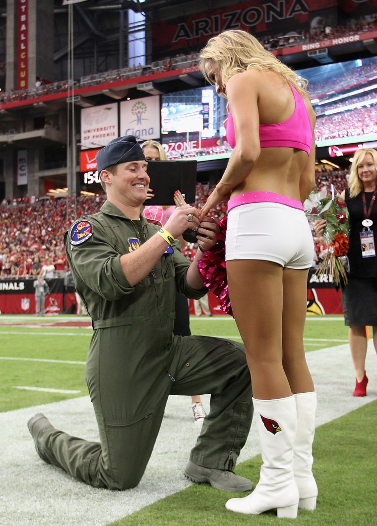 Air Force captain Eric Straub popped the question to girlfriend Claire Thornton, a cheerleader for the Arizona Cardinals, after the first quarter of the Cardinals' game against Redskins on Sunday.