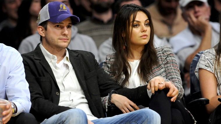 The newly engaged actors Ashton Kutcher and Mila Kunis attend an NBA basketball game between theNew Orleans Pelicans and Los Angeles Lakers, Tuesday, ...
