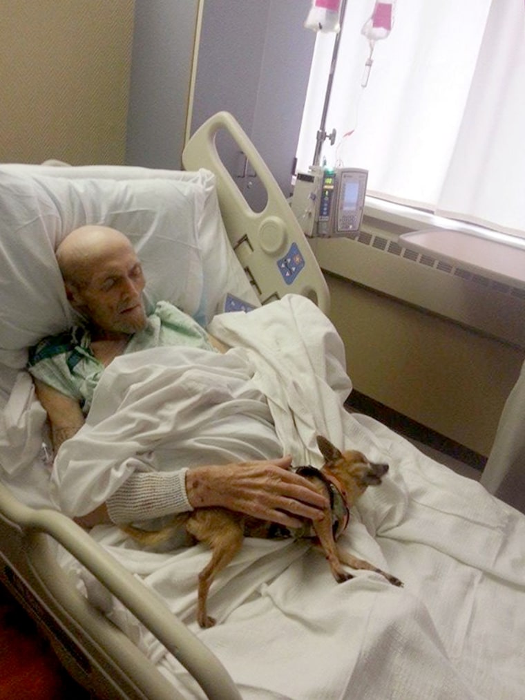 James Wathen rests with his dog, Bubba, after their second reunion since Wathen was hospitalized.