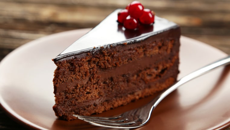 Dark chocolate cake on brown wooden background; Shutterstock ID 224415979; PO: TODAY.com