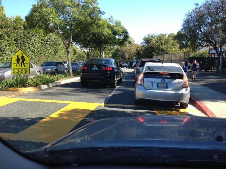 Hey, black car -- we see you trying to cut into the school pick up line. You are violating Rule #4 !