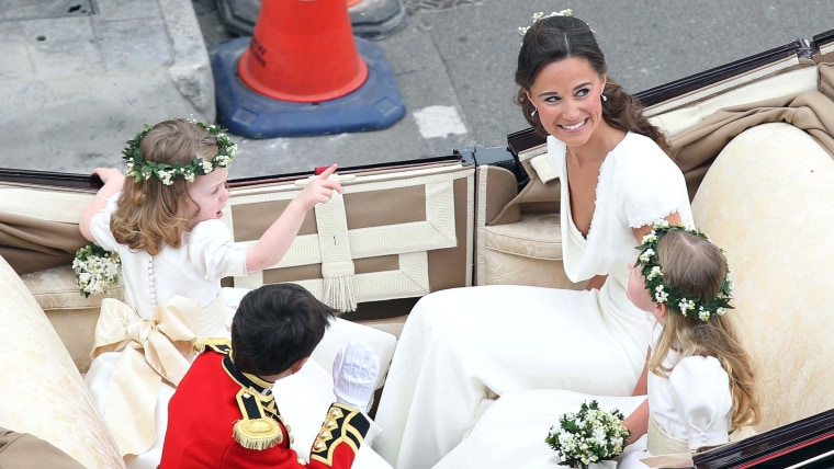 LONDON, ENGLAND - APRIL 29:  Maid of Honour Pippa Middleton with brides maids and page boy make the journey by carriage procession to Buckingham Palac...