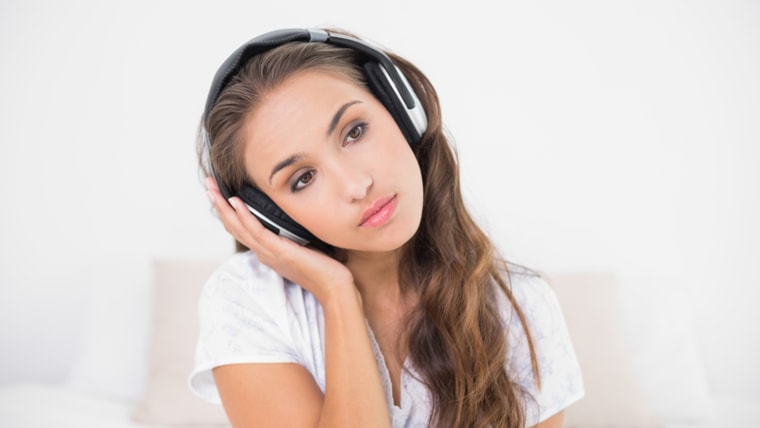 brunette listening to music in bright bedroom; Shutterstock ID 158709437; PO: TODAY.com