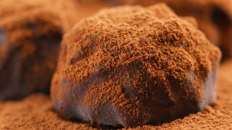 dark chocolate truffles sprinkled with cocoa powder