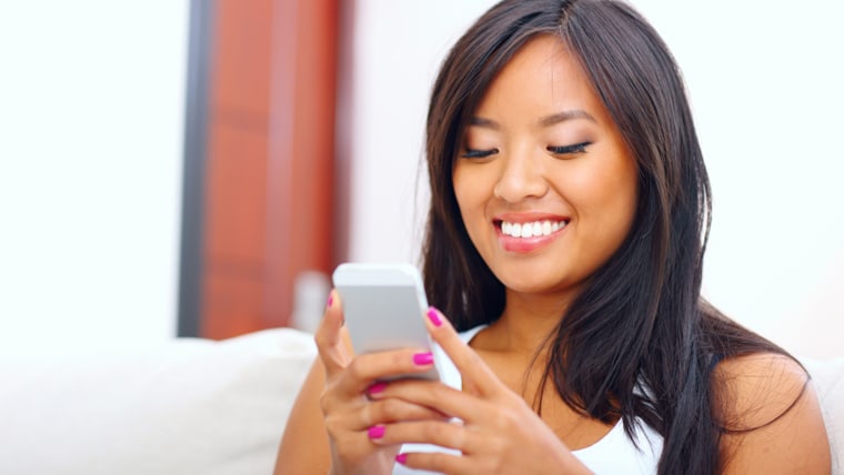 woman text messaging with her smart phone at home; Shutterstock ID 147694604; PO: TODAY.com