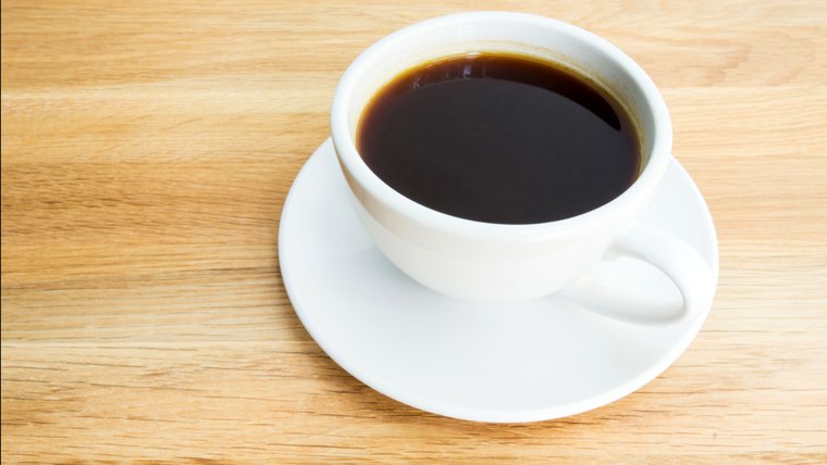 Black coffee on wooden table; Shutterstock ID 188572103; PO: today.com