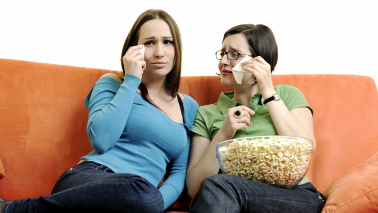 two young woman isolated on white looking tv and cry; Shutterstock ID 55791676; PO: today.com