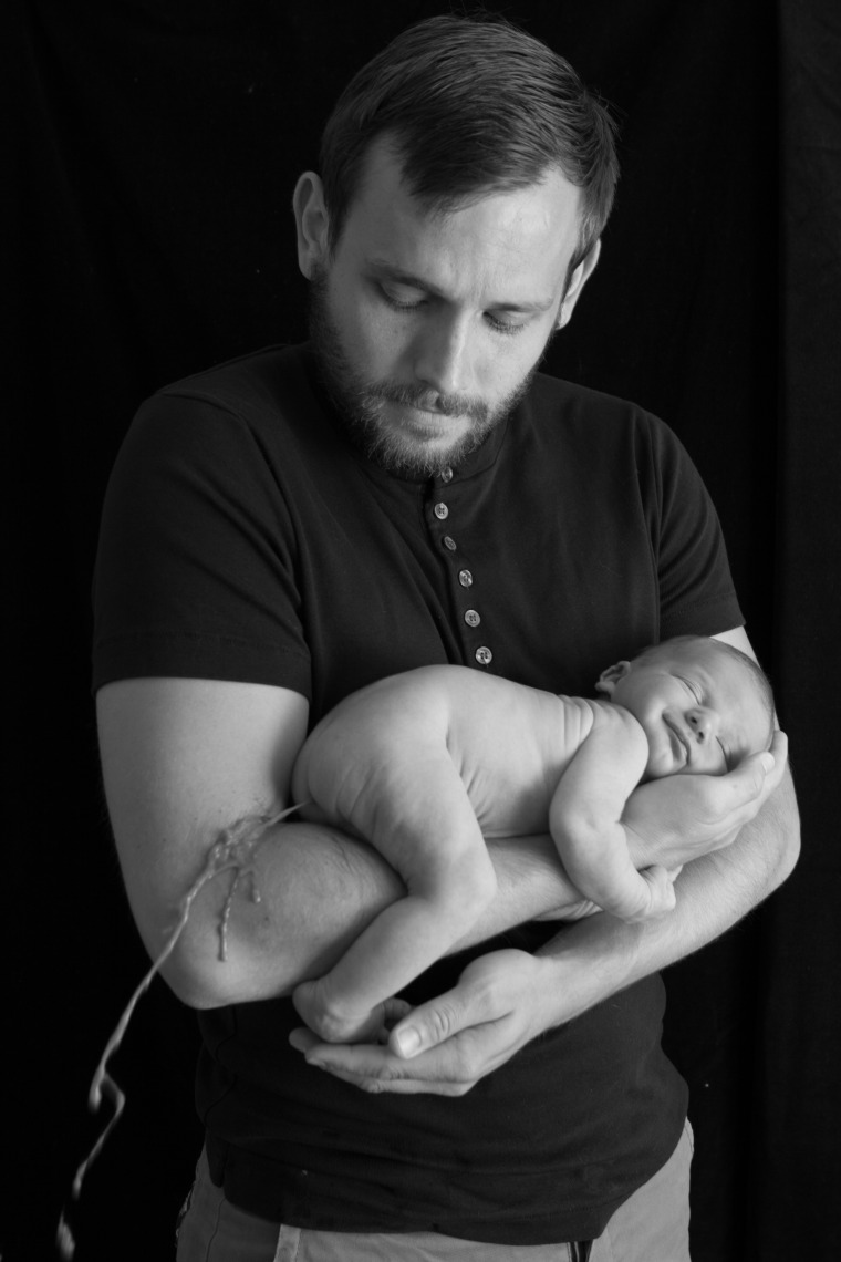 …Baby Ted lets it all loose. On dad’s arm.