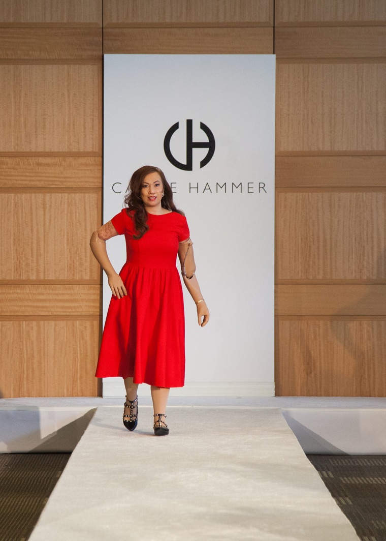 Crespo walks down the runway wearing \"The Karen,\" which Carrie Hammer named after her.