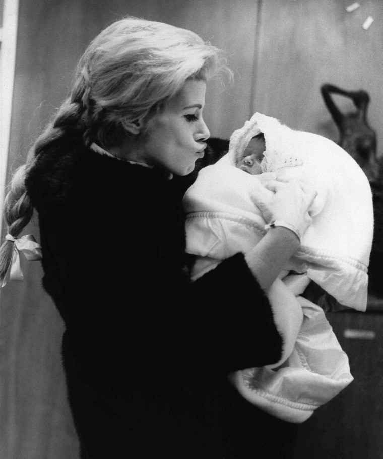 Comedienne Joan Rivers with daughter Melissa as they leave Lenox Hill Hospital, Jan. 1968, where the baby, Joan's first, was born on January 20. Fathe...