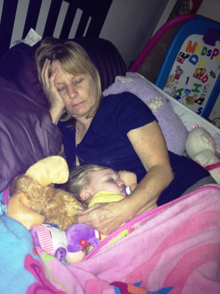 Noelle Dunham and her grandmother Cynthia Petersen napping at home.