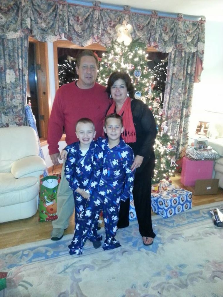 A grandparents' work is never done! Eddie and Lorraine Hutter with grandsons P.J. and Jackson on Christmas Eve, 2013.