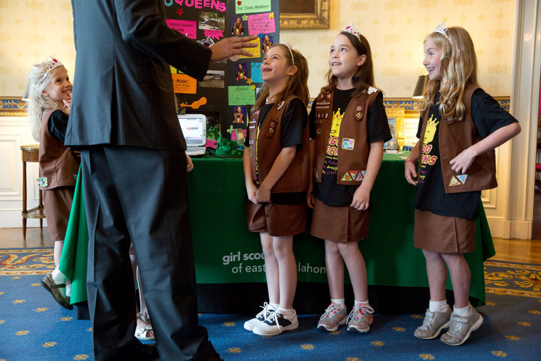 President Barack Obama talks with 8 year-old members of Girl Scout Troop 2612 from Tulsa, Okla., during the 2014 White House Science Fair, in the Blue...