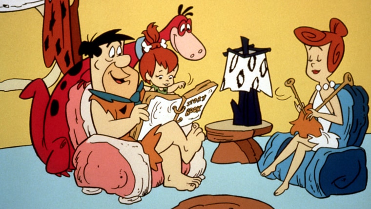 Dino with his family, \"The Flintstones.\"