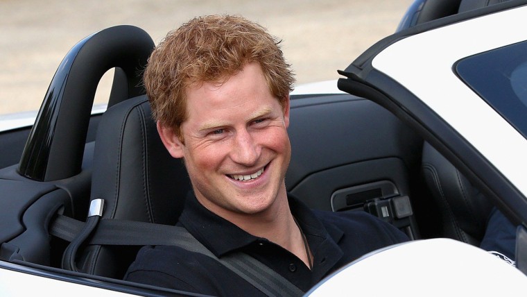 Britain's Prince Harry sits in the driving seat of an F-Type Jaguar during the Jaguar Landrover driving Challenge ahead of the Invictus Games on Septe...