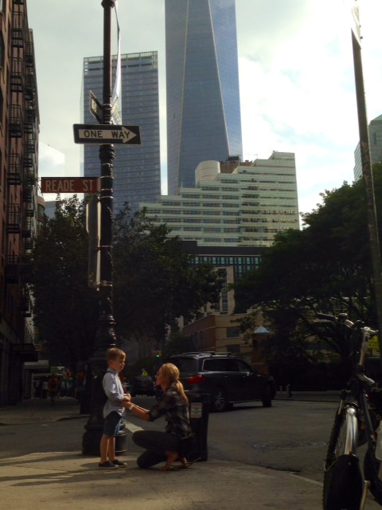 Jacoba Urist and her son in front of the Freedom Tower in lower Manhattan.