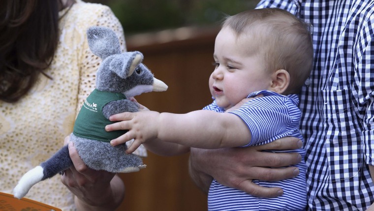 Britain's Prince George holds a toy Bilby during a visit to Taronga Zoo in Sydney, Australia April 20, 2014. Prince William and his wife Catherine, th...