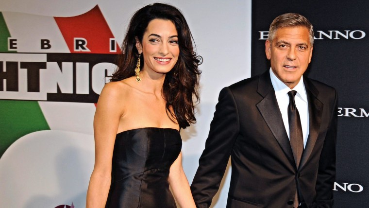 epa04389820 US actor-director George Clooney (R) arrives with his fiancee, British-Lebanese human rights lawyer Amal Alamuddin for the 'Celebrity Figh...