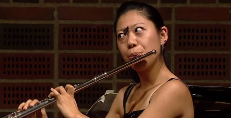 Image: Butteryfly on flutist