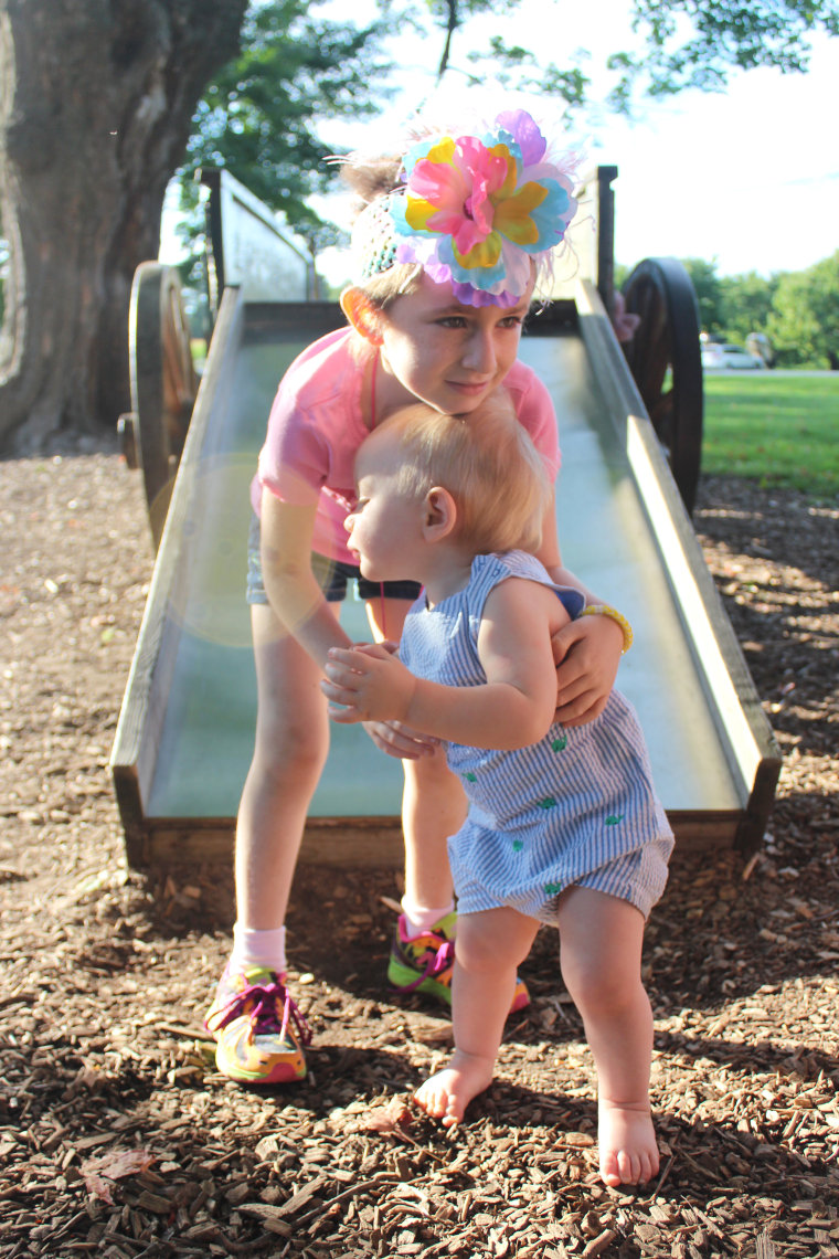 Brooke Hester hugs her 1-year-old brother, Benjamin.