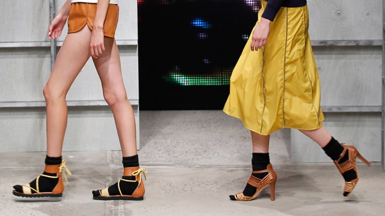 Models walks the runway wearing socks with sandals at the Band Of Outsiders Women's fashion show during Mercedes-Benz Fashion Week Spring 2014 on Sept...