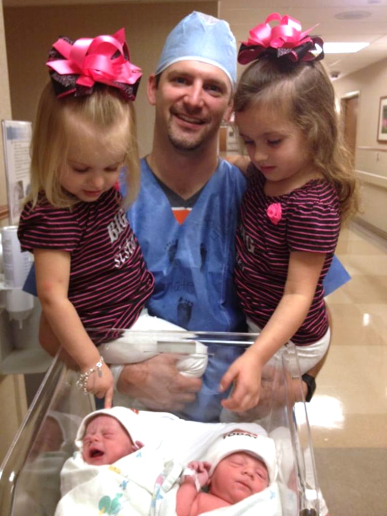 The Jansen twins at birth, along with dad Allan Jansen and sisters Hailey and Mia.