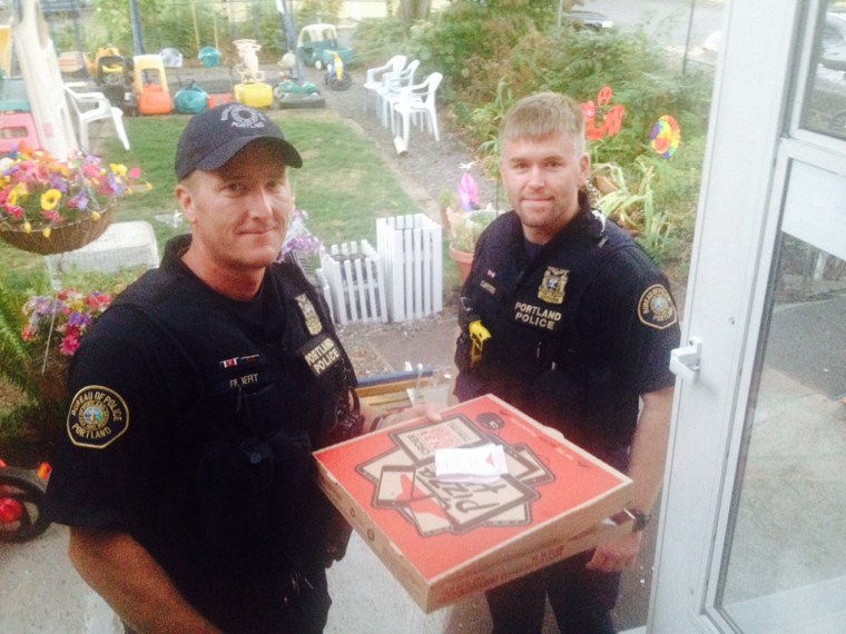 Police officers reportedly delivered a pizza after a deliveryman was injured in an accident.