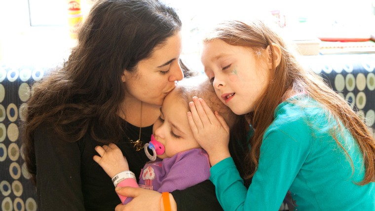 Loving you: Andrea Verdone Gorsegner with her daughter Natalie, fighting cancer, and older daughter Hannah, now 7, on the right.