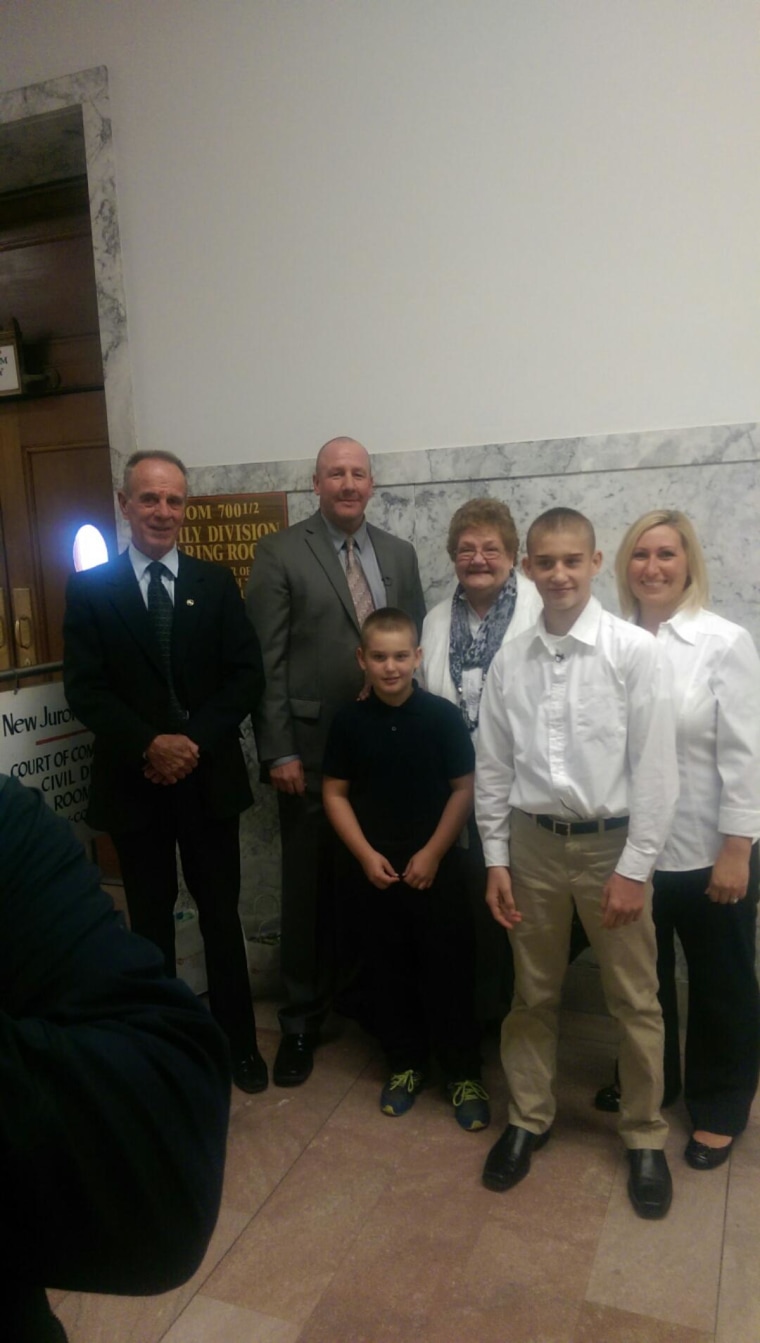 Forever family: Jack Mook on adoption day with, from left, his father, (also) Jack Mook; Jessee (in black); his mother Jacqueline Mook, Joshua, and niece Christie Kaelin.