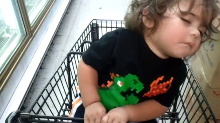 Boy in grocery cart