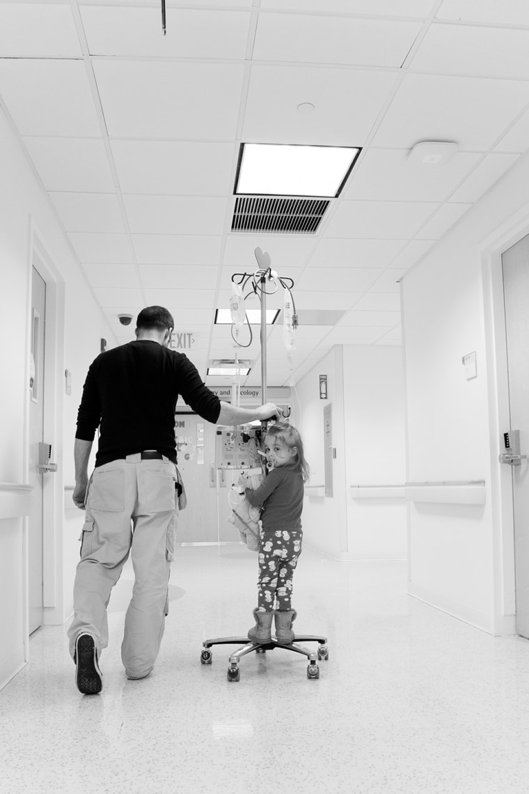 No walk in the park: Natalie strolls the hospital hallways with Dad.