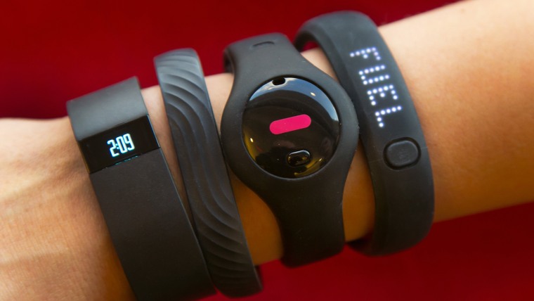  Four fitness trackers are shown in this photograph, in New York,  Monday, Dec. 16, 2013. They are, from left, Fitbit Force, Jawbone Up, Fitbug Orb, a...