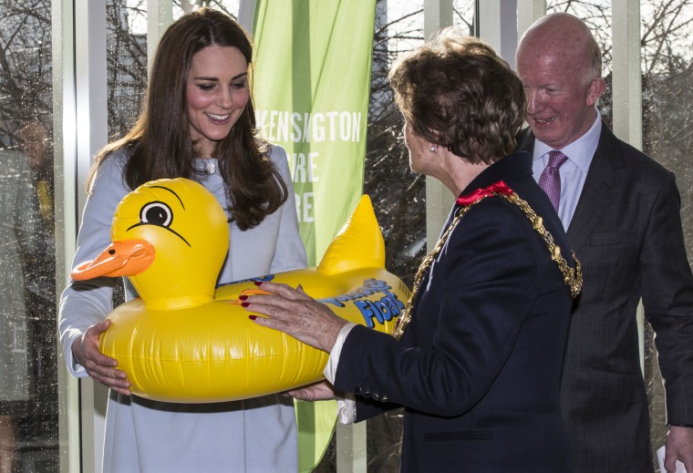 Catherine, Duchess of Cambridge is presented with a large inflatable duck for Prince George from Mayor of Kensington an...