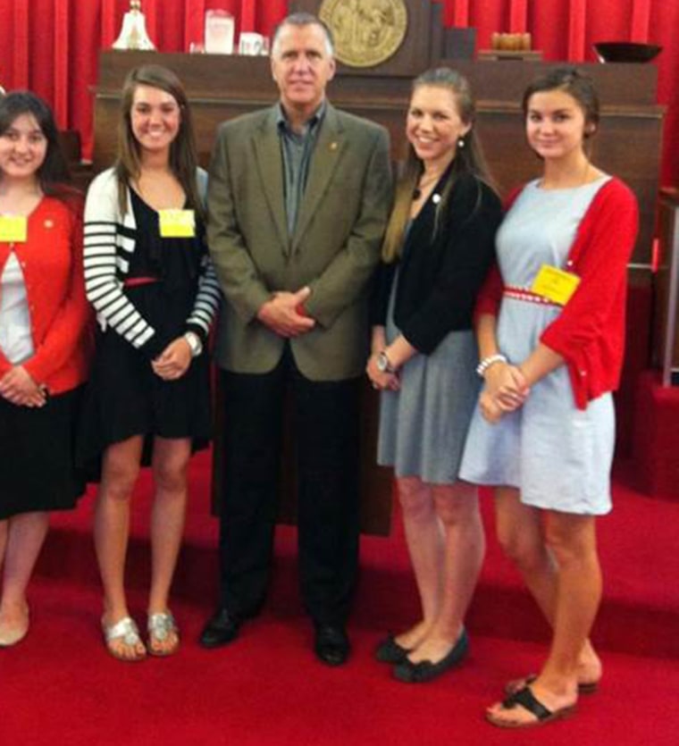 Anna Huffman, on the far left, says many of the dresses she wears to political events would violate her high school dress code.