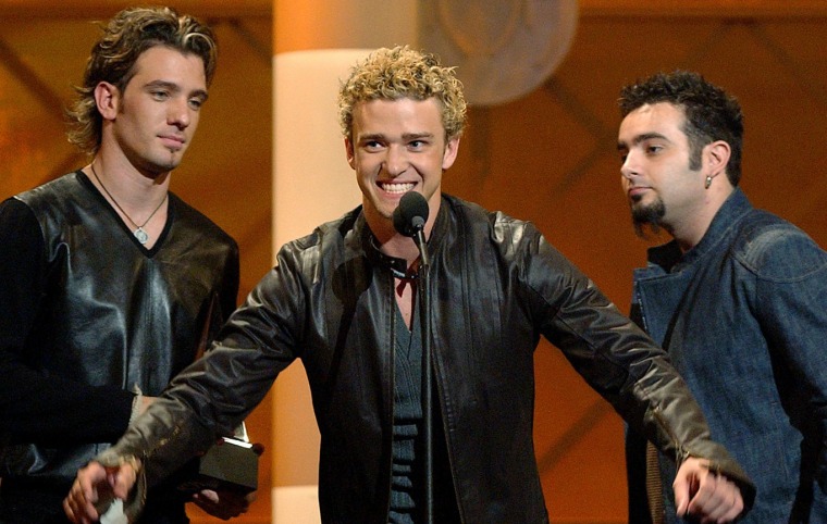 The group N'Sync, from left, JC Chasez, Justin Timberlake and Chris Kirkpatrick, accept the group's award for favorite pop or rock group at the 29th A...