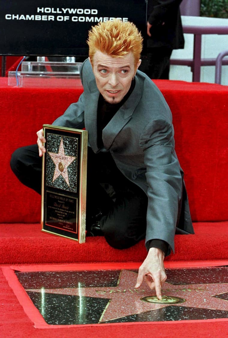 Image: Bowie poses with his new star on the Hollywood Walk of Fame