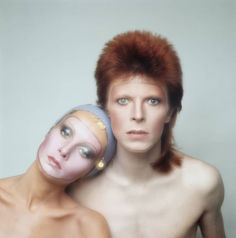 Image: English model Twiggy poses with David Bowie