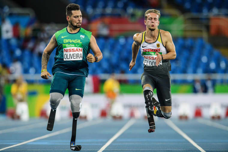 Image: Brazil's Alan Fonteles Cardoso Oliveira and Germany's Johannes Floors compete during a heat of men's 100-meter