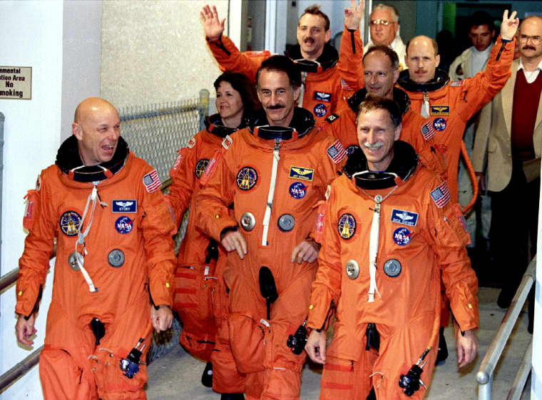 The crew of the space shuttle Endeavour is shown leaving their quarters for the launching pad Decemb..