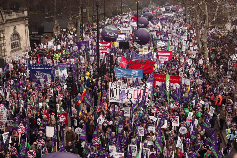 Image: A mass march in protest at government cuts sets off from Embankment in London