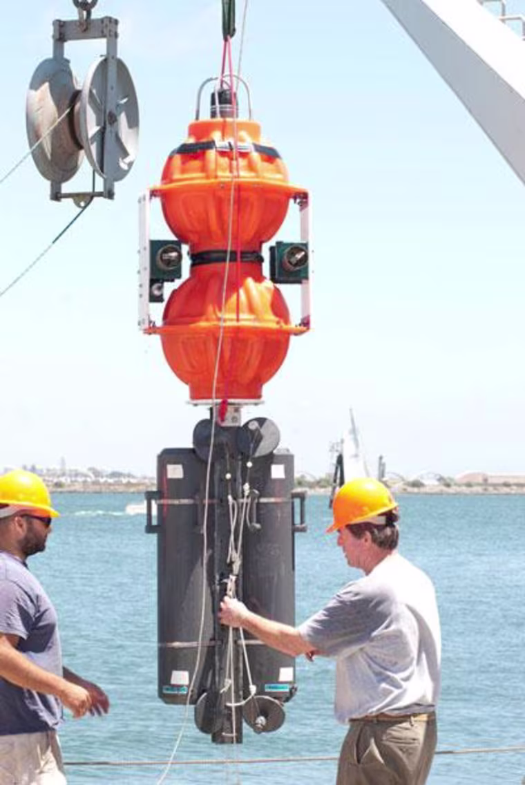Scripps ocean engineer Kevin Hardy (right) and marine technician Josh Manger prepare to test Hardy's deep-sea lander at Scripps' Nimitz Marine Facility.