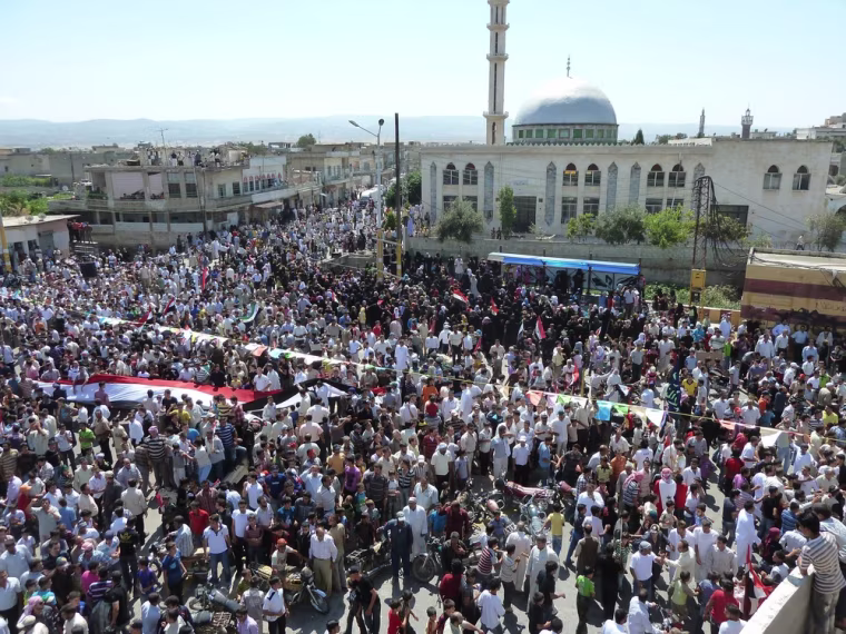 Image: Demonstrators protesting against Syria's President Bashar al-Assad gather in Hula