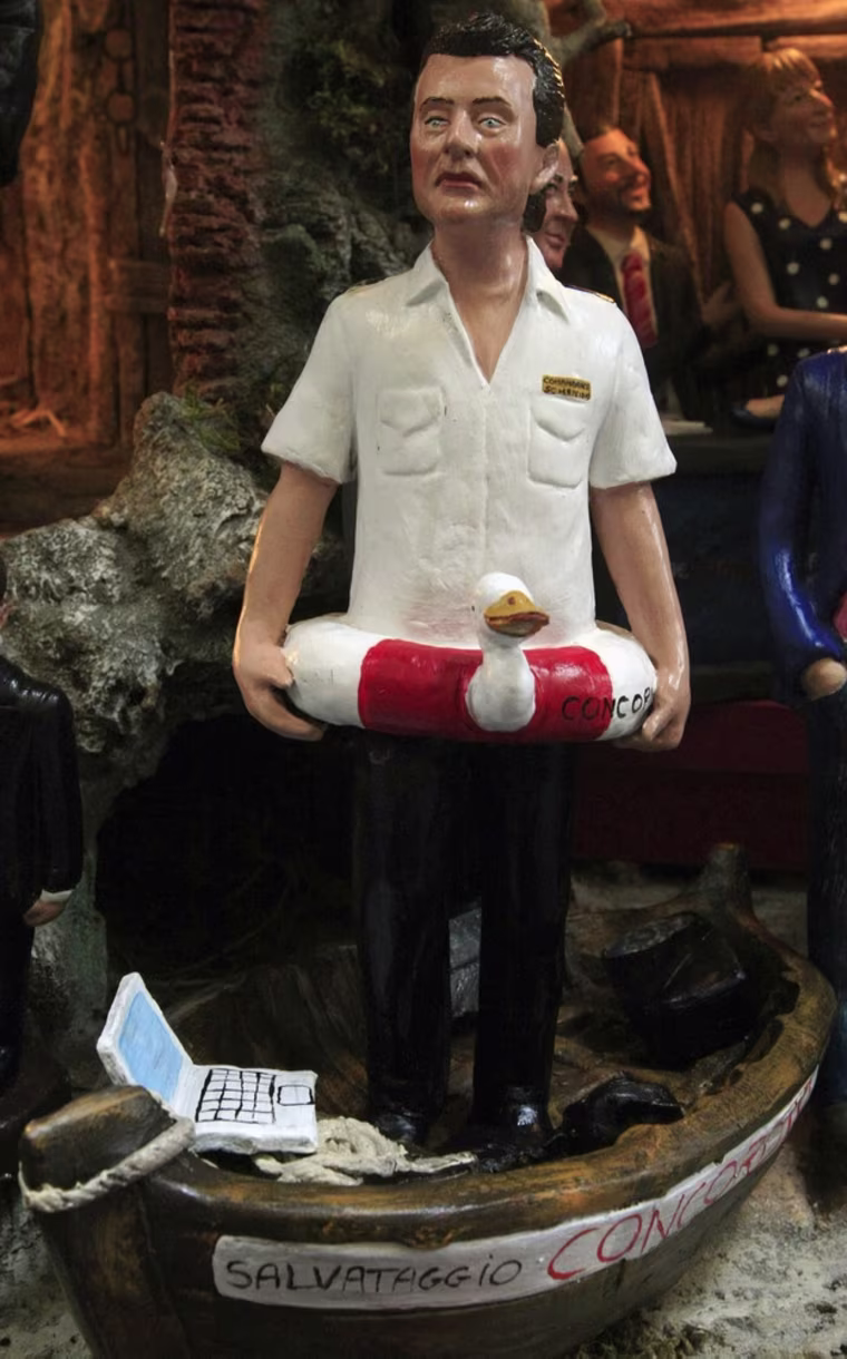 Image: A figure of Costa Concordia cruise ship captain Schettino is displayed outside a shop on San Gregorio Armeno street in Naples